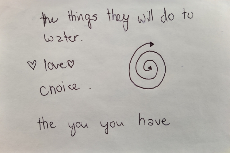 An index card on which is written "the things they will do to water, love, choice, the things you have." Next to the text a swirl has been drawn with two arrow points on either end.